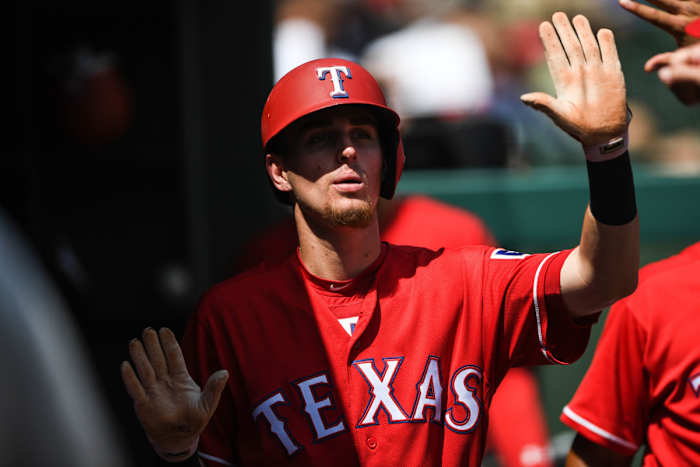 Sep 19, 2018; Arlington, TX, USA; Texas Rangers center fielder Carlos Tocci (15) celebrates with teammates after scoring a run during the third inning against the Tampa Bay Rays at Globe Life Park in Arlington. Mandatory Credit: Shanna Lockwood-USA TODAY Sports